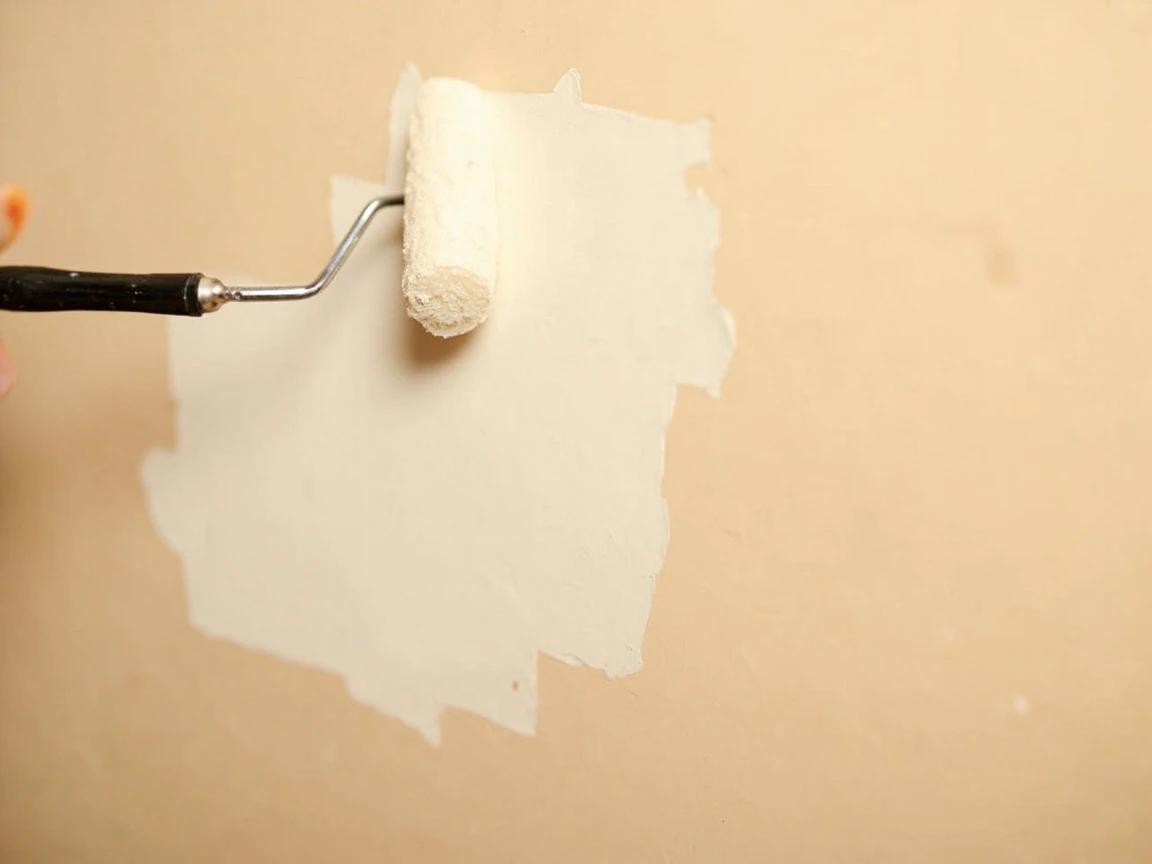 Step 9 of How to Patch a Large Hole in Drywall (Mesh or California Patch): Sand smooth, prime, and paint