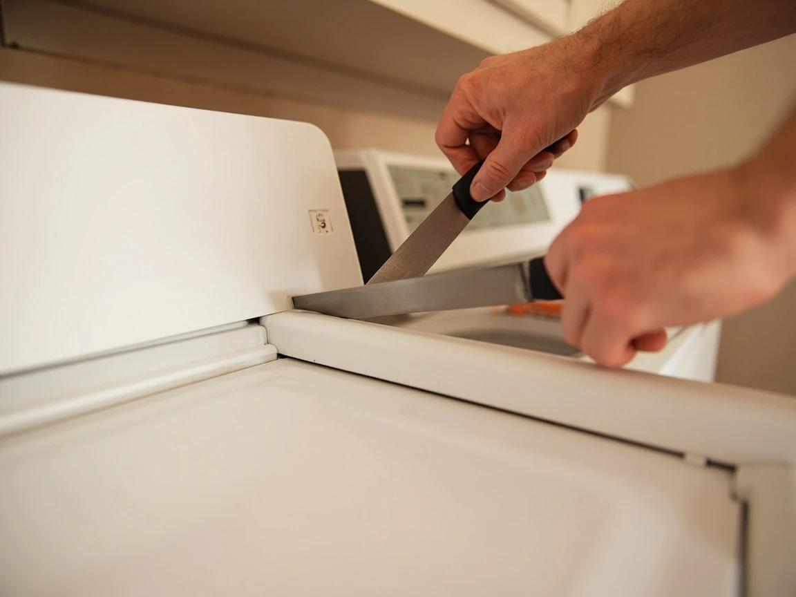 Step 4 of How to Replace a Dryer Belt: Open the Top: Lint Screen Screws, Then the Hidden Clips